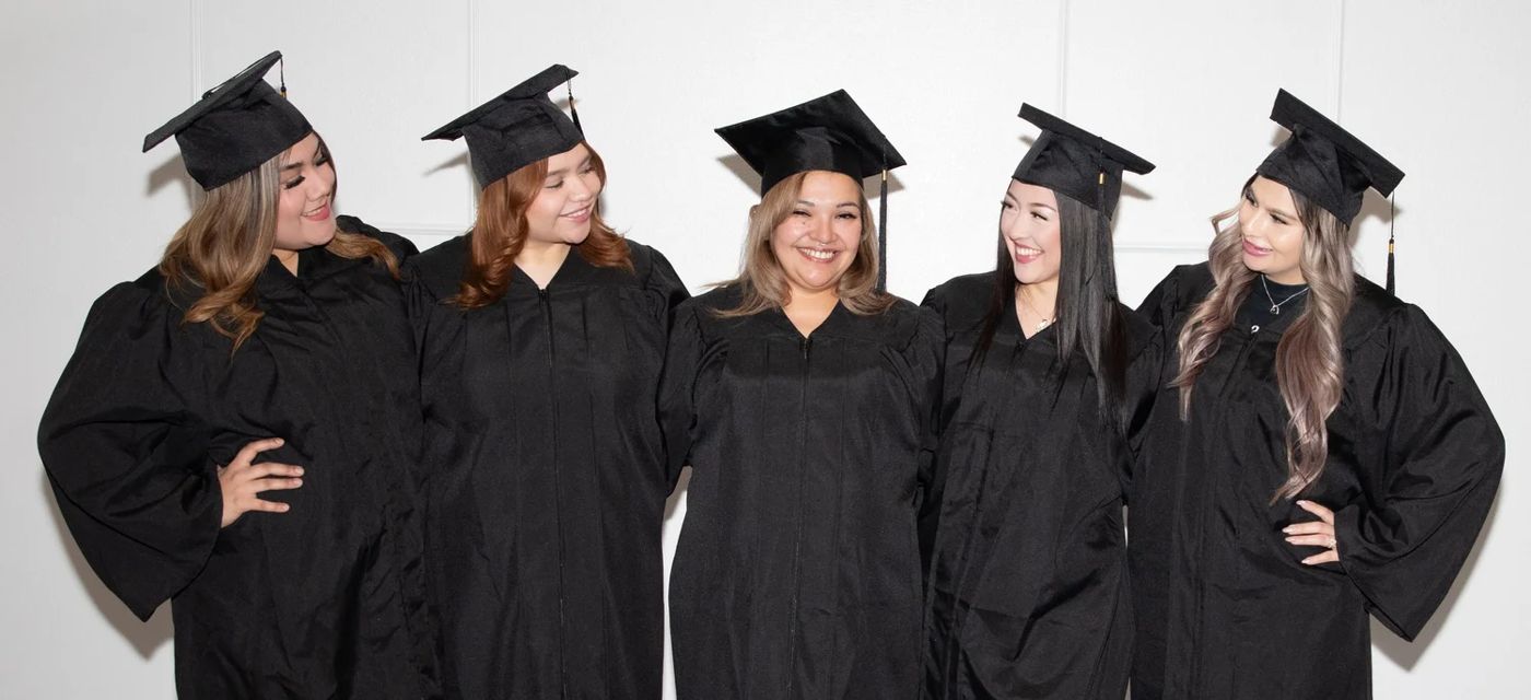 NuGen Academy graduating class in caps and gowns