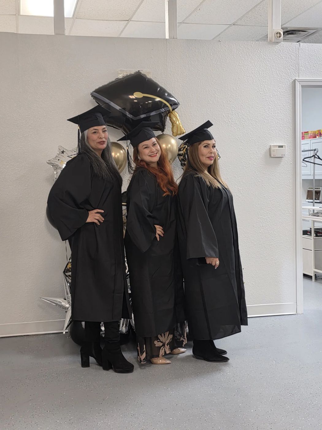 Graduates celebrating at NuGen Esthetics Academy